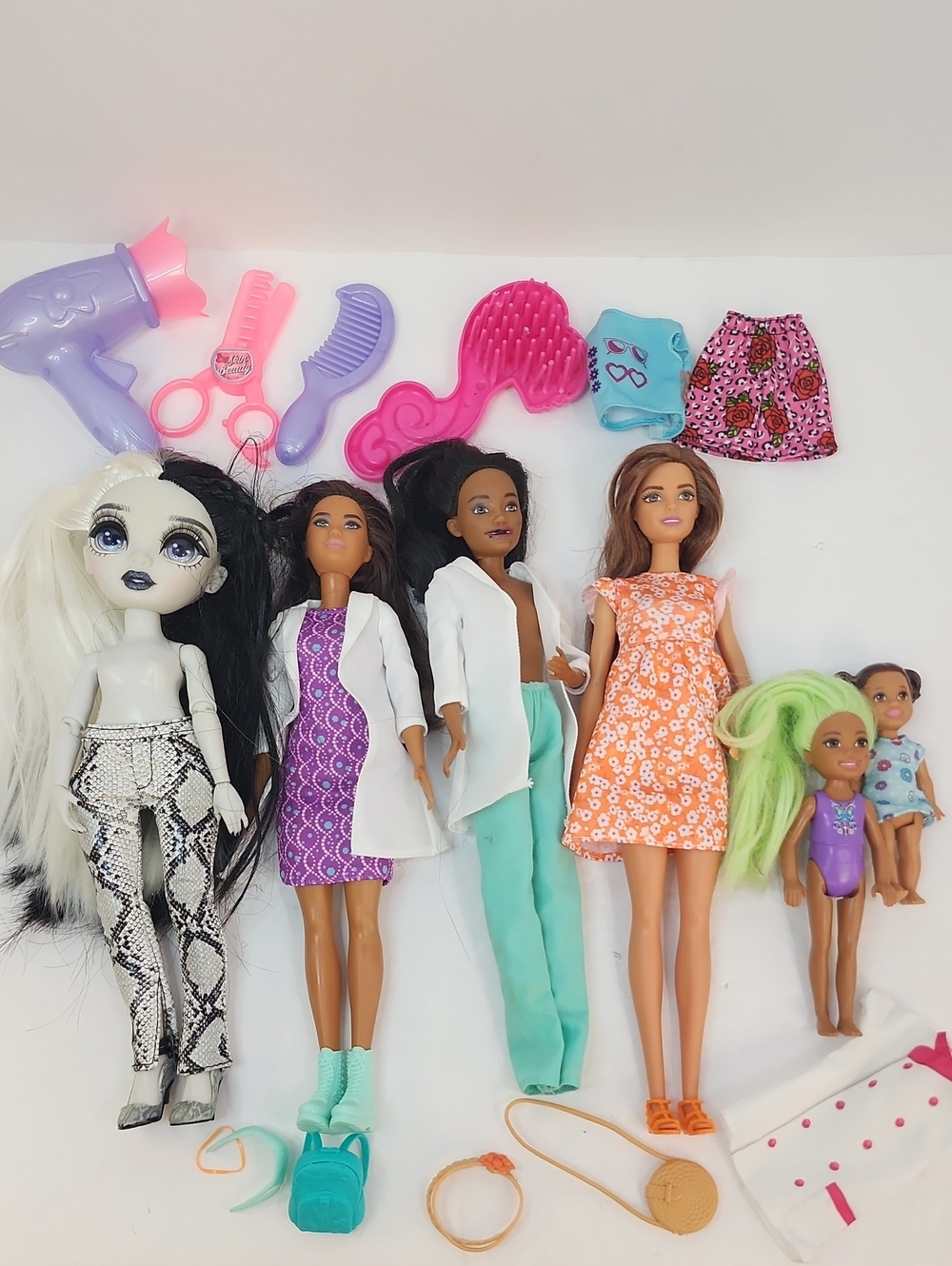 Barbie and Assorted Fashion Dolls Playset with Pink and Purple Accessories